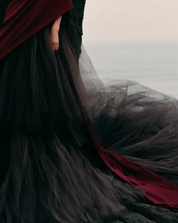 Layered black tulle and burgundy velvet train